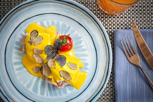 Plate of fresh pasta with truffle and tomato